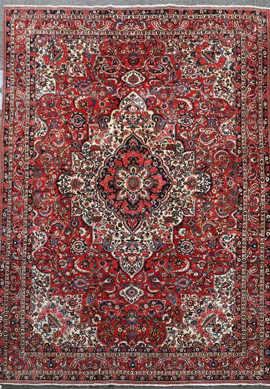 A Bakhtiar Chaleshotor red ground carpet, 14ft by 10ft 8in.